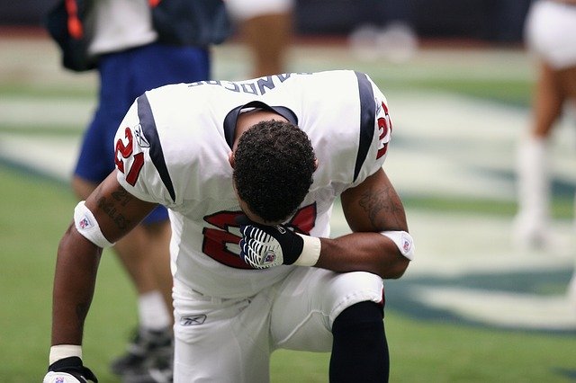 Football player kneeling